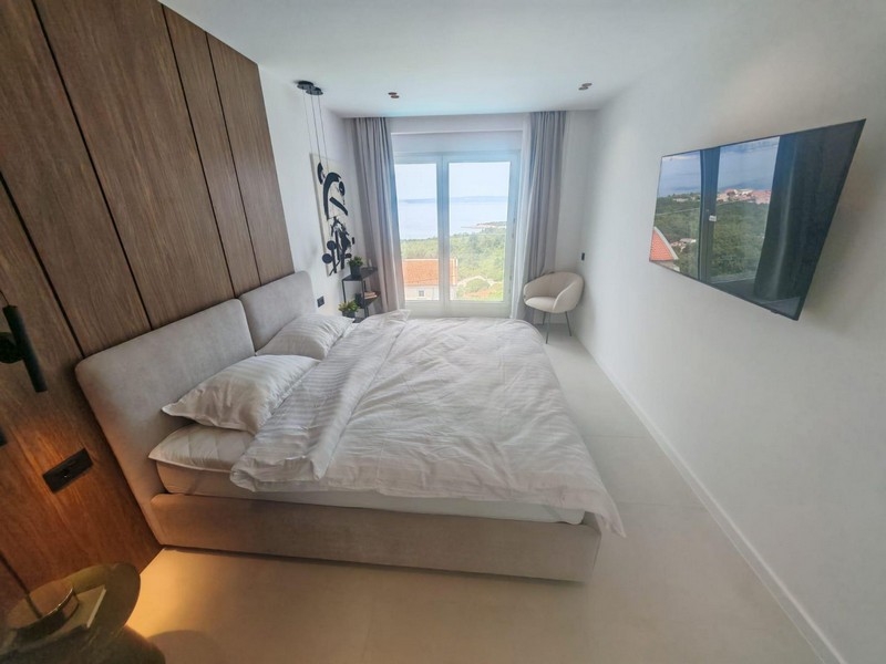 Bedroom with balcony door and view of nature