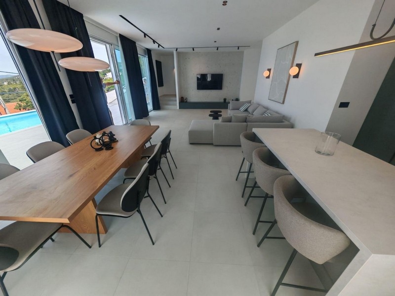 Dining area with wooden table and kitchen counter