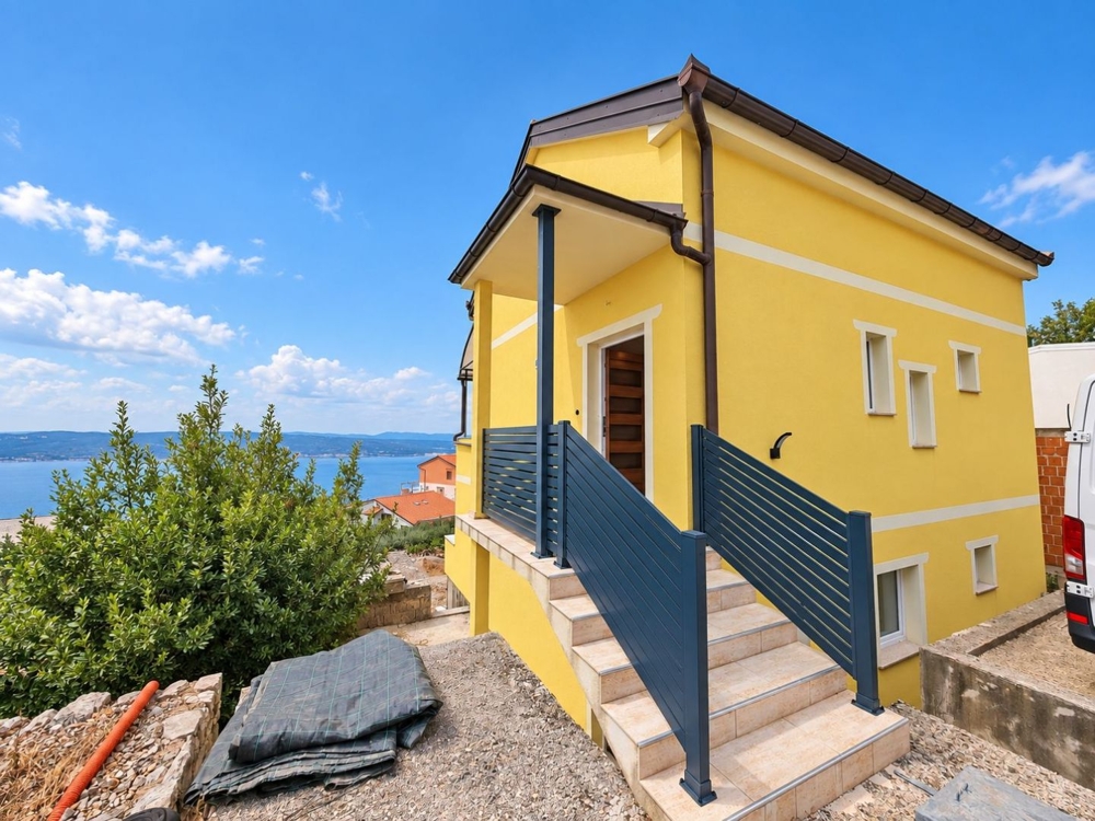 External stairs to the entrance overlooking the sea