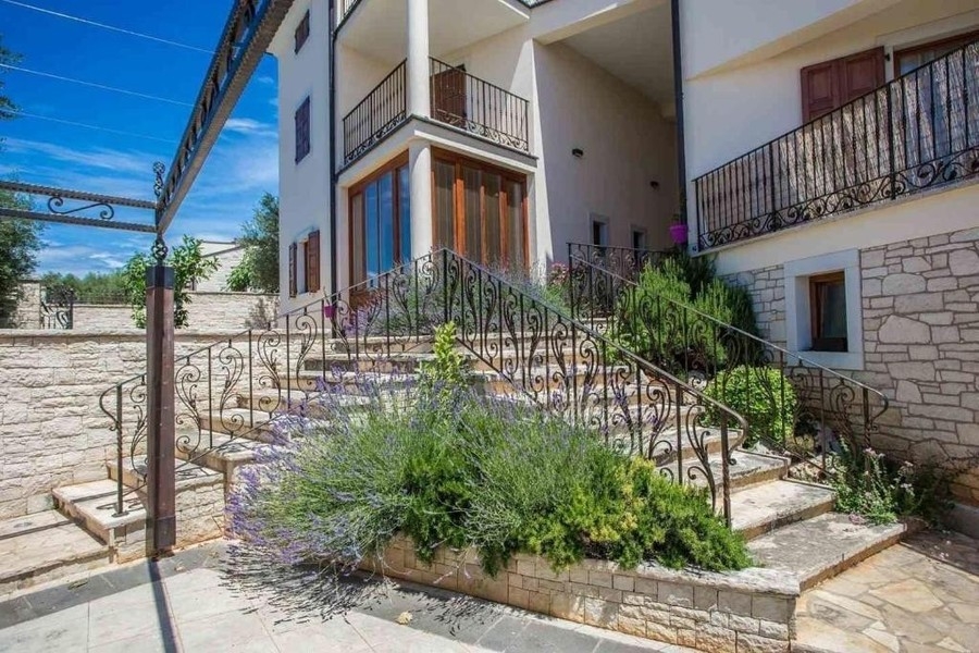 Exterior of house with stairs and lavender