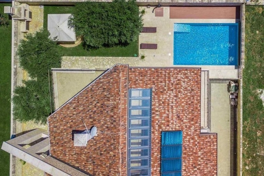 Aerial view of house, garden and pool
