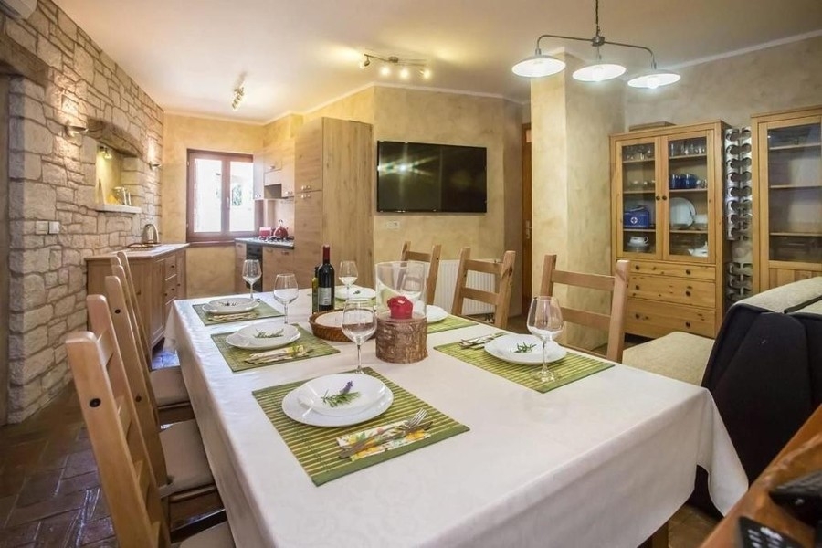 Dining area with natural stone wall