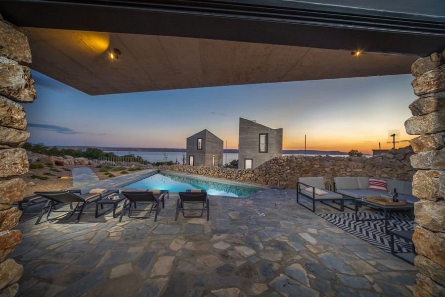 Covered terrace with lounge at dusk