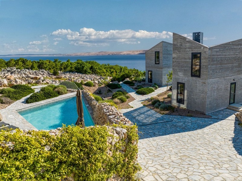 Pool and paved paths between the villas