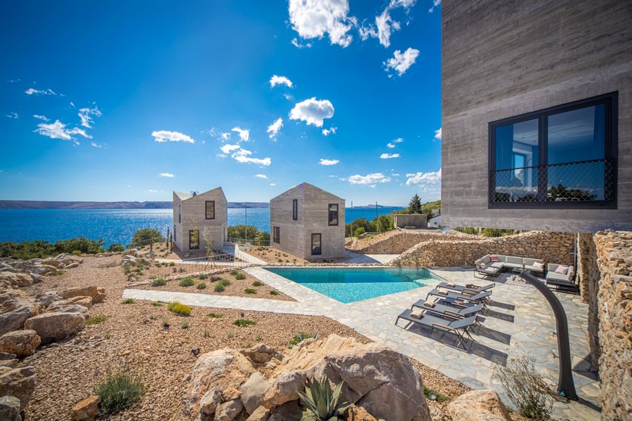 Pool terrace with sun loungers and sea views