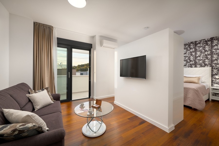 Bedroom with sitting area and balcony door