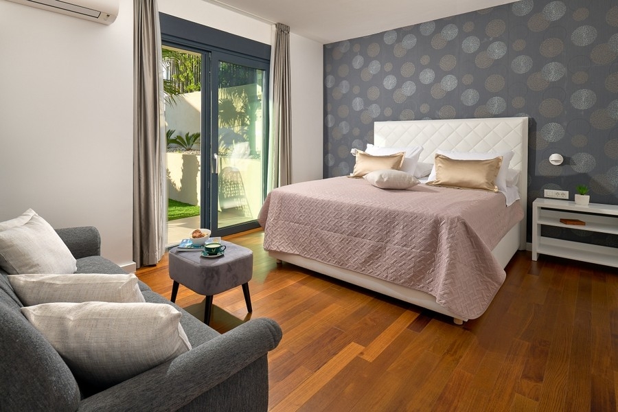 Bedroom with double bed and garden access