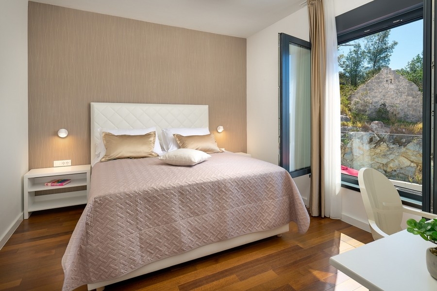 Bedroom with double bed and large window