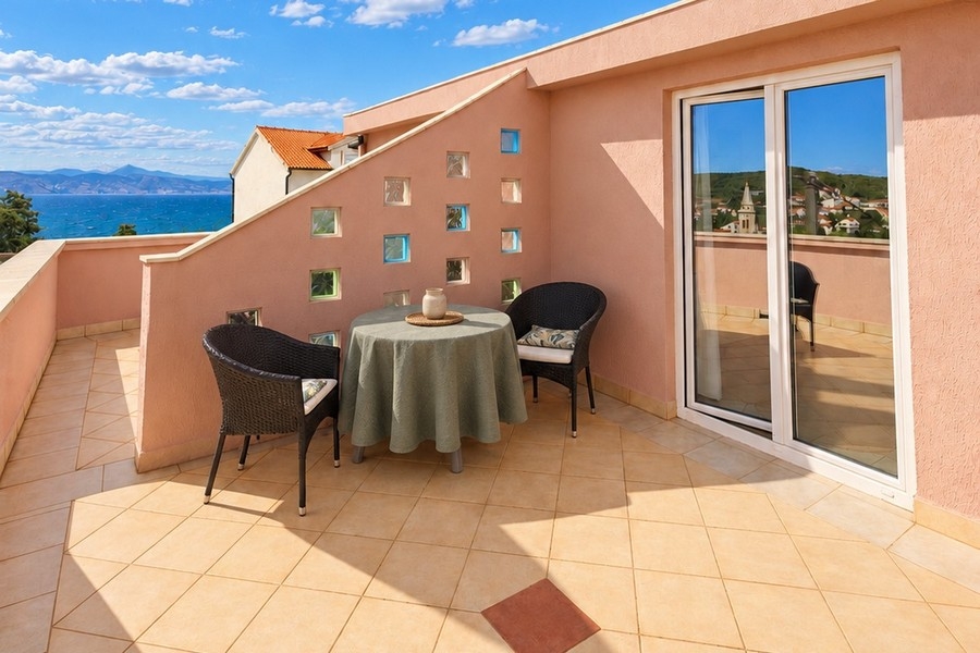 Terrace with seating and views of the sea
