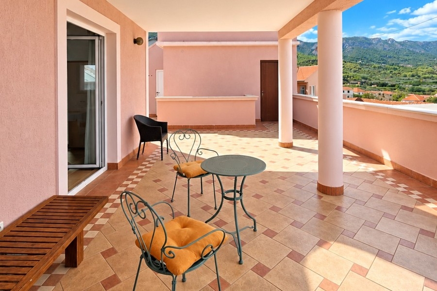 Covered terrace of the apartment on the first floor