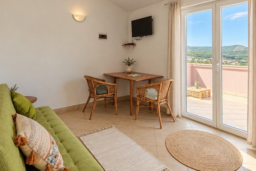 Living room of an apartment with sofa and patio door