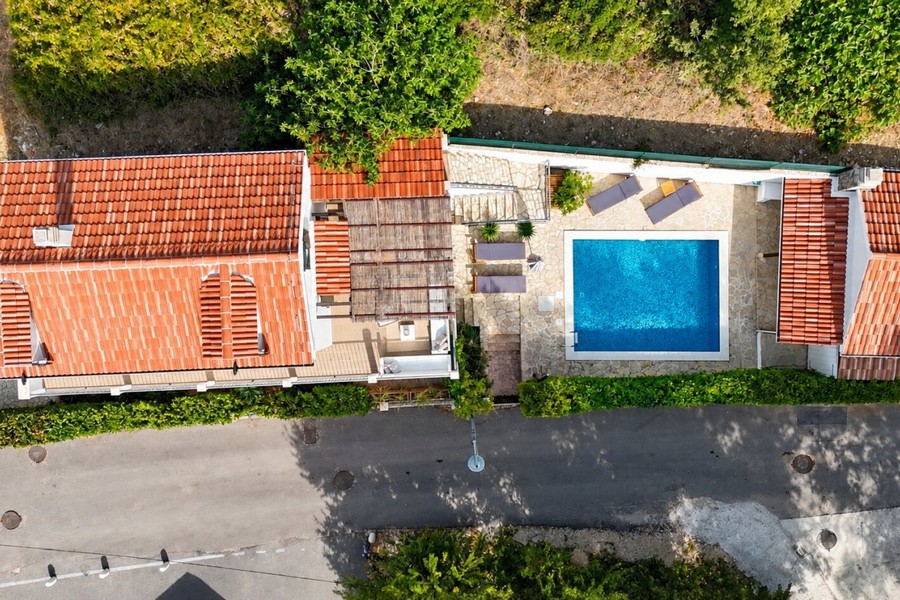 Aerial view of house with pool and parking space