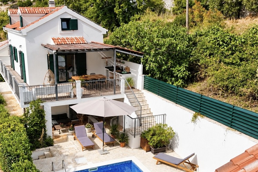 View from above of the terrace, pool and garden