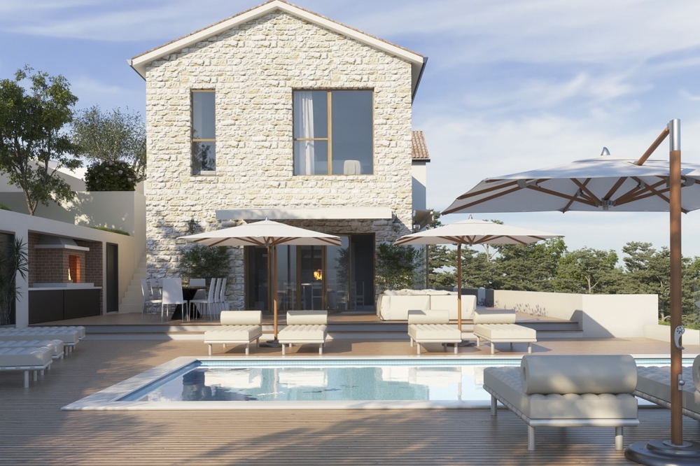 Pool terrace with parasols and loungers in front of the villa