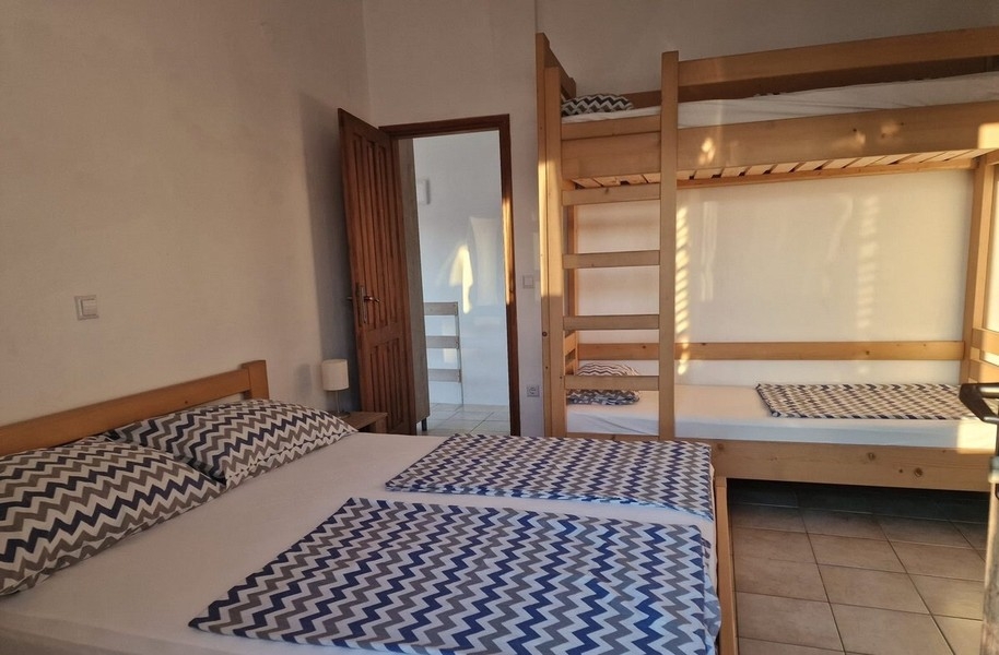 Bedroom with double bed and bunk bed