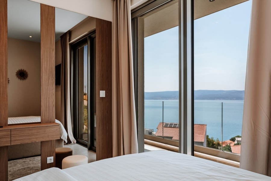 Bright bedroom with views over the coast