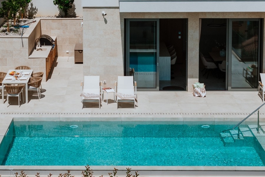 Pool with sun loungers on the terrace