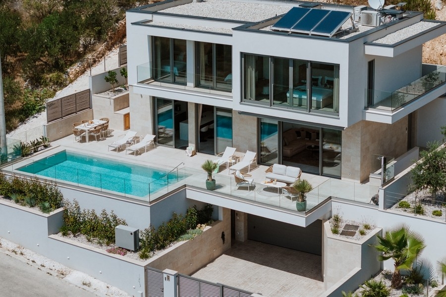 Exterior view of the villa with pool and terraces