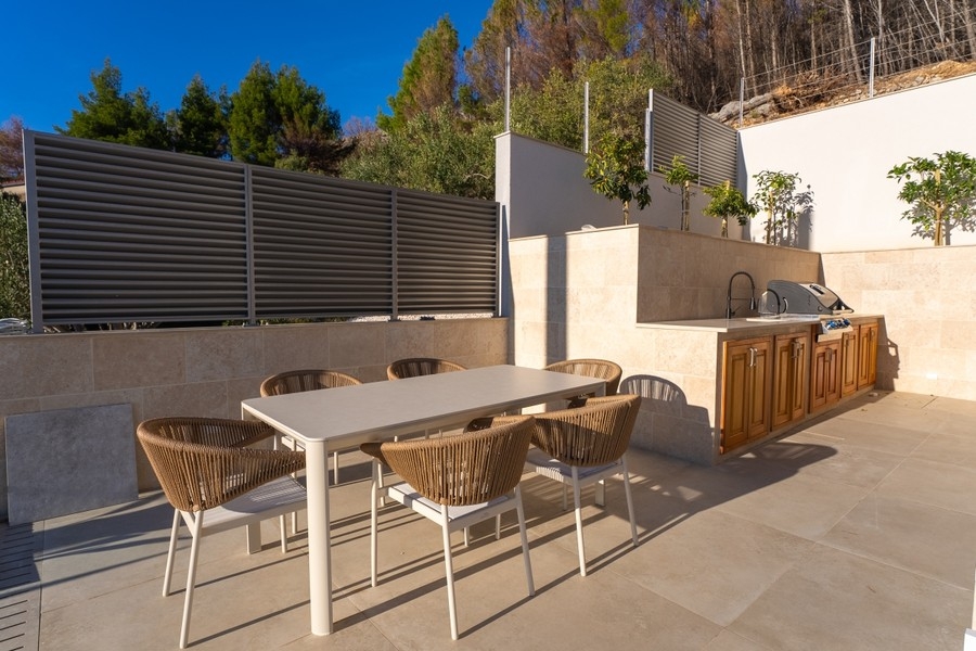 Outdoor dining area with outdoor kitchen