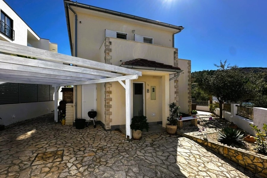 Exterior view of the villa with covered parking space