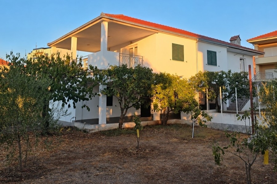 Exterior view of the house with garden