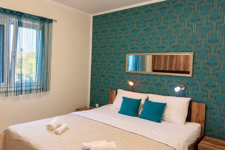 Bedroom with turquoise wall