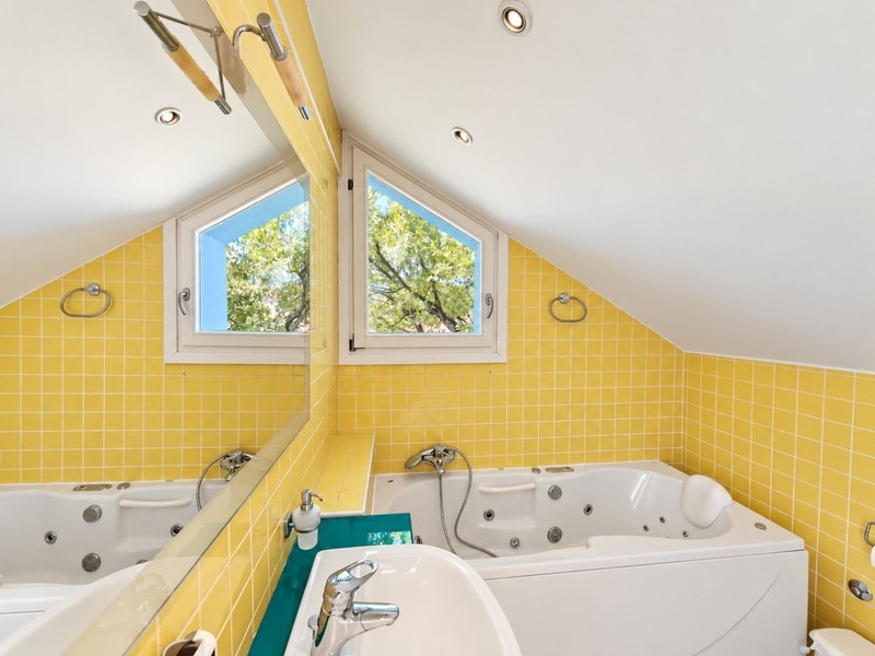 Bathroom with bathtub in the attic
