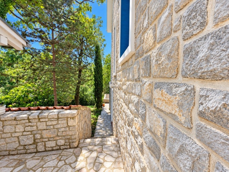 Stone facade and path along the house