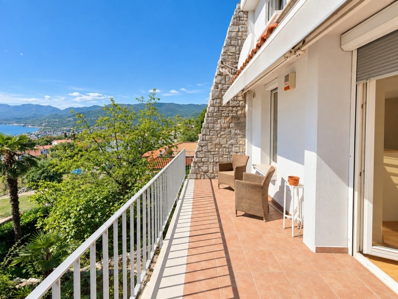 Terrace on the upper floor with seating and sea views