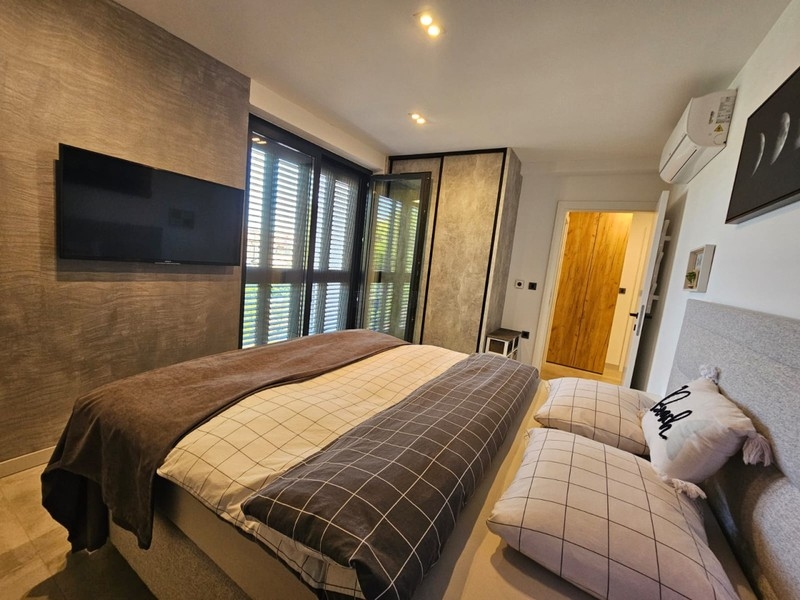 Bedroom with double bed and air conditioning
