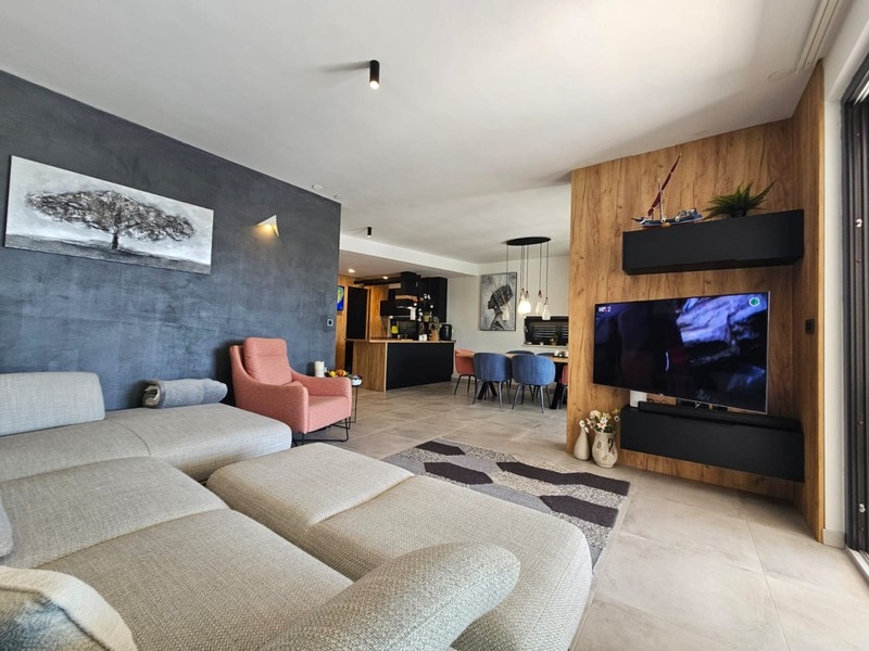 Open living area with sofa and television
