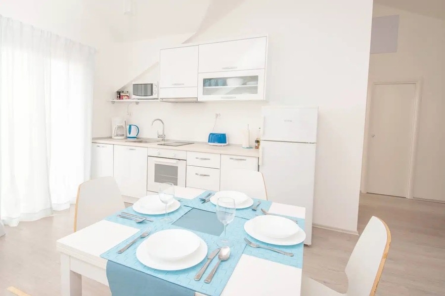 Kitchen with dining table in the upper apartment