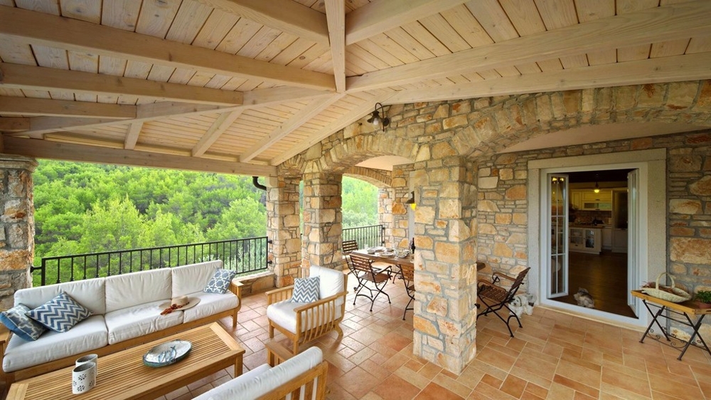 Lounge terrace with wooden ceiling and view of the greenery