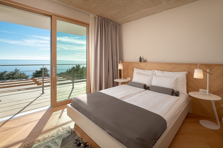 Bedroom with large window front and sea view
