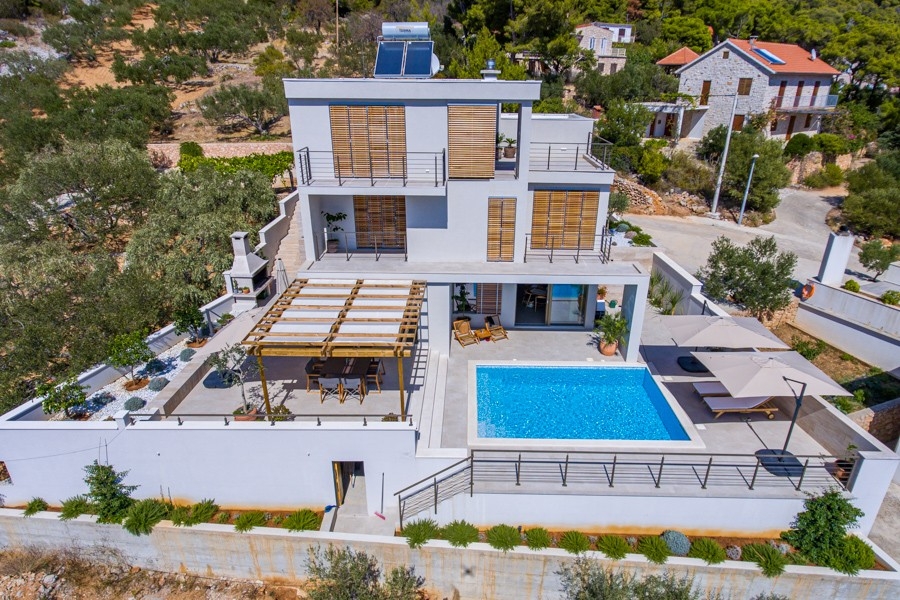 Modern villa with pool terrace on a hillside