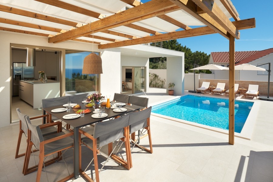 Pergola with dining table and summer kitchen