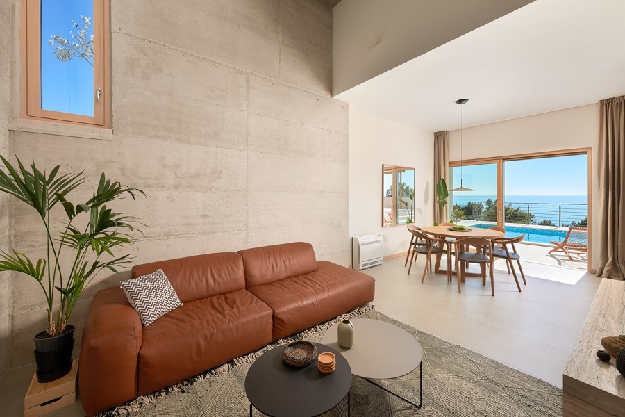 Living room with leather sofa and view of the sea