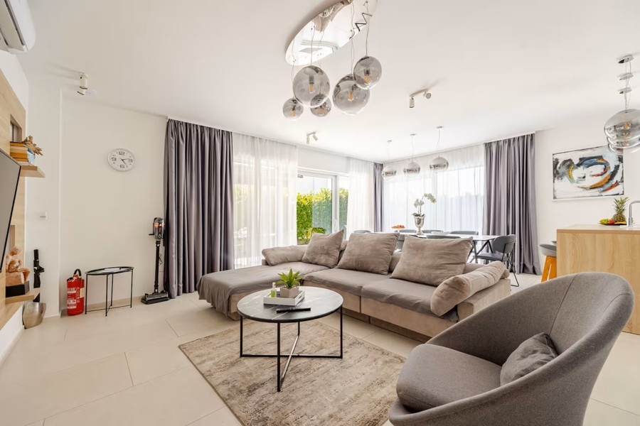 Living room with corner sofa and glass lights