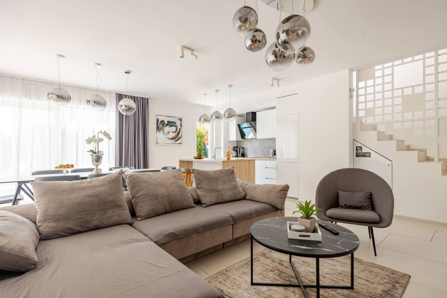 Open living area with sofa and dining table