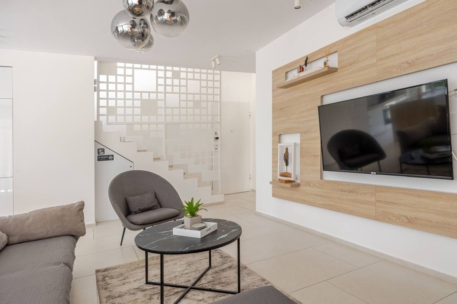 Living area with stairs to the upper floor