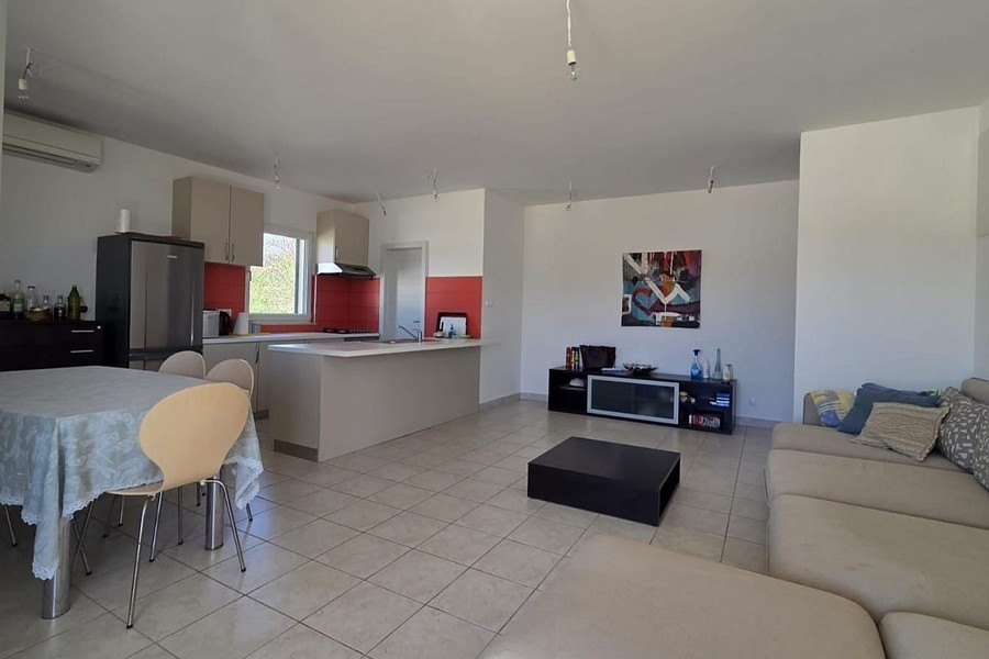 Dining area with kitchen and television