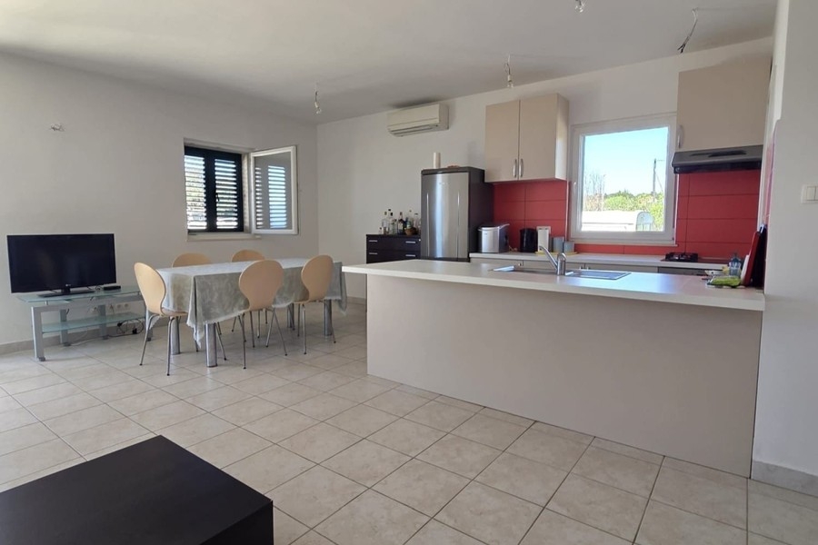 Kitchen with counter and dining table