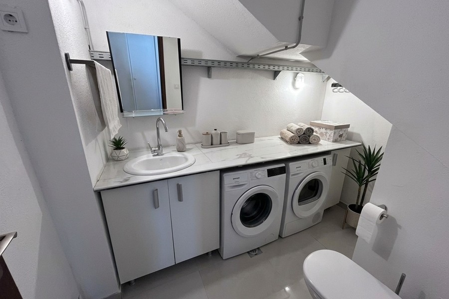 Laundry room with washing machine and dryer