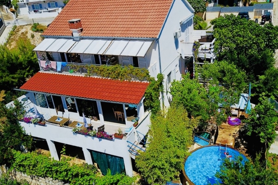House with terraces and pool from above