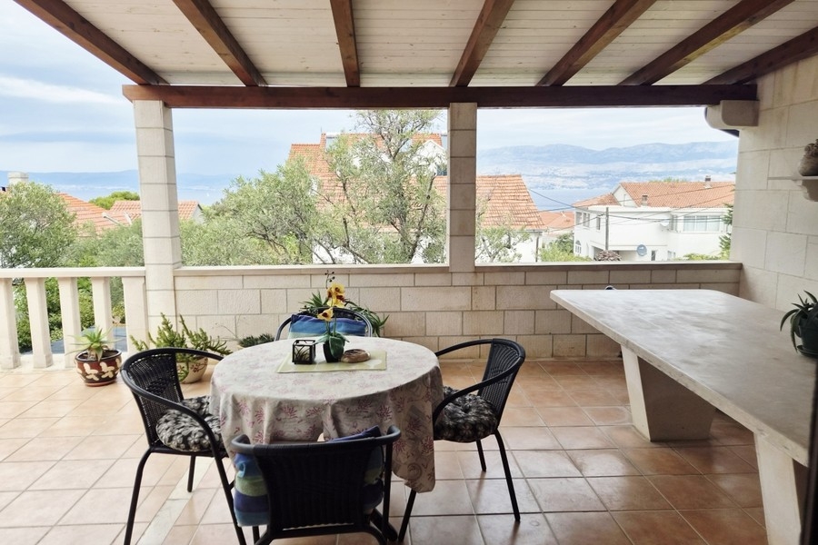Stone house with sea views in Supetar, terrace with seating