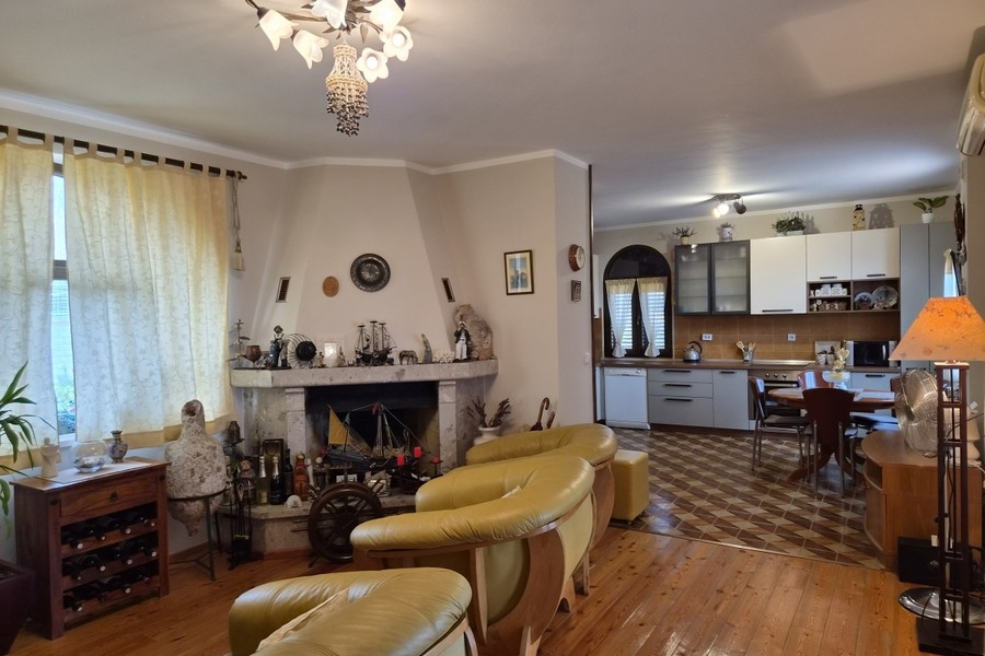 Living room with fireplace and leather sofas