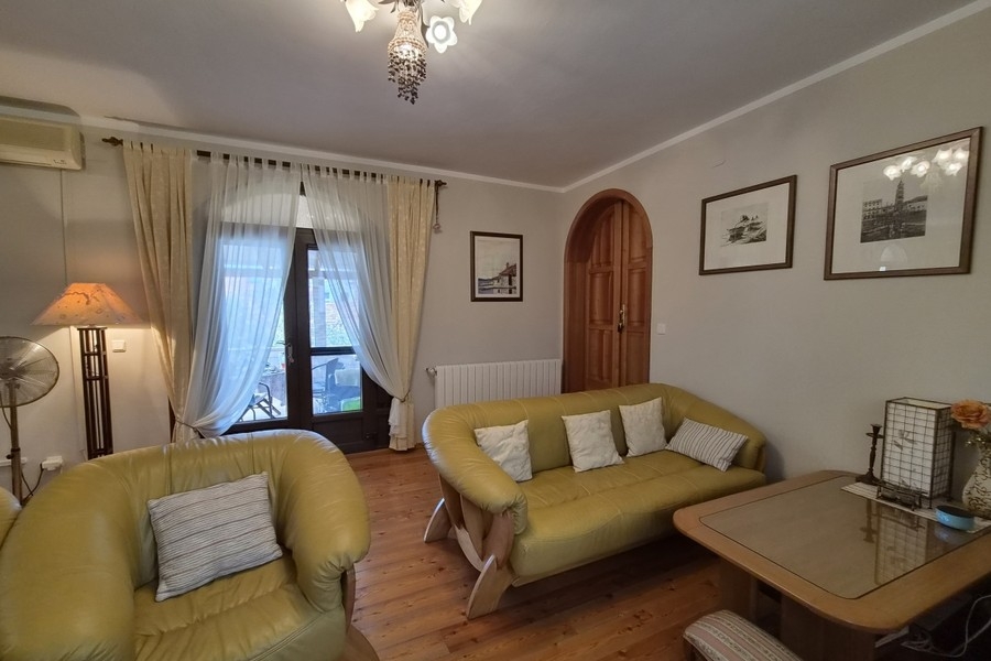 Living room with sofa and French window