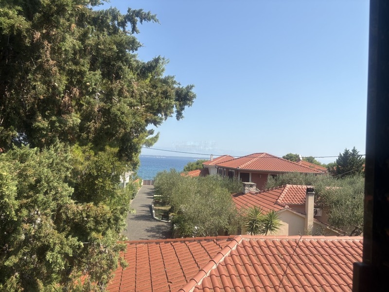 View from the balcony over the roofs to the sea