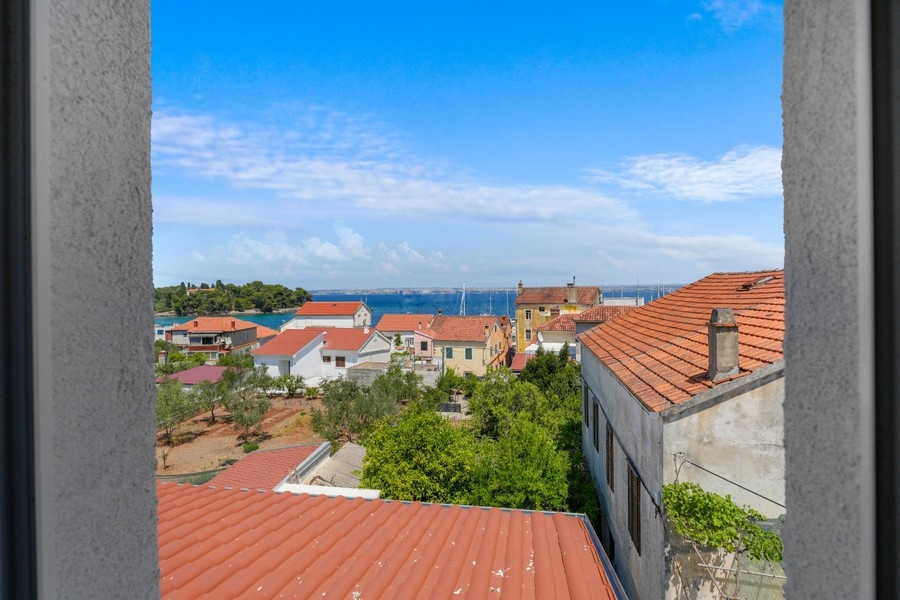 View over the roofs of Preko to the sea