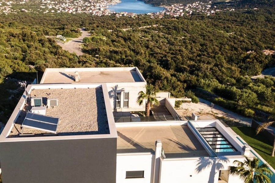 Aerial view of the villa with surroundings and bay